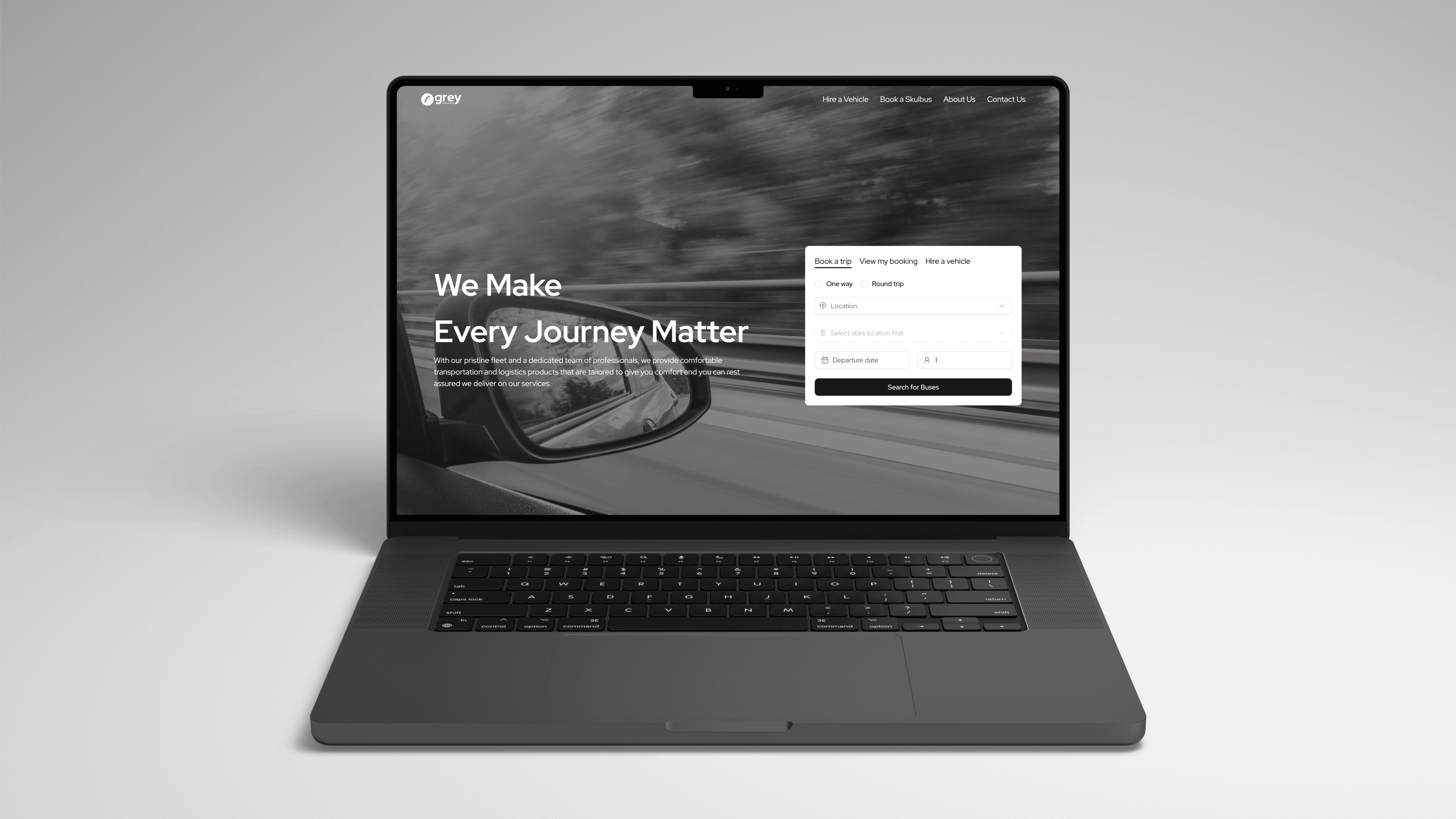 Grey Automotive landing page on a Macbook